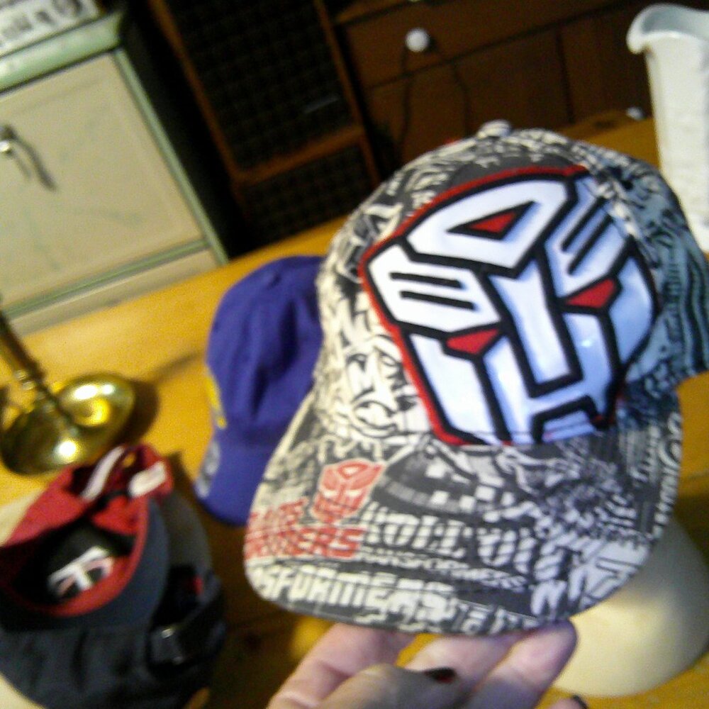 BOLD PRINT GRAPHIC TRANSFORMER HAT ONE SIZE FITS ALL